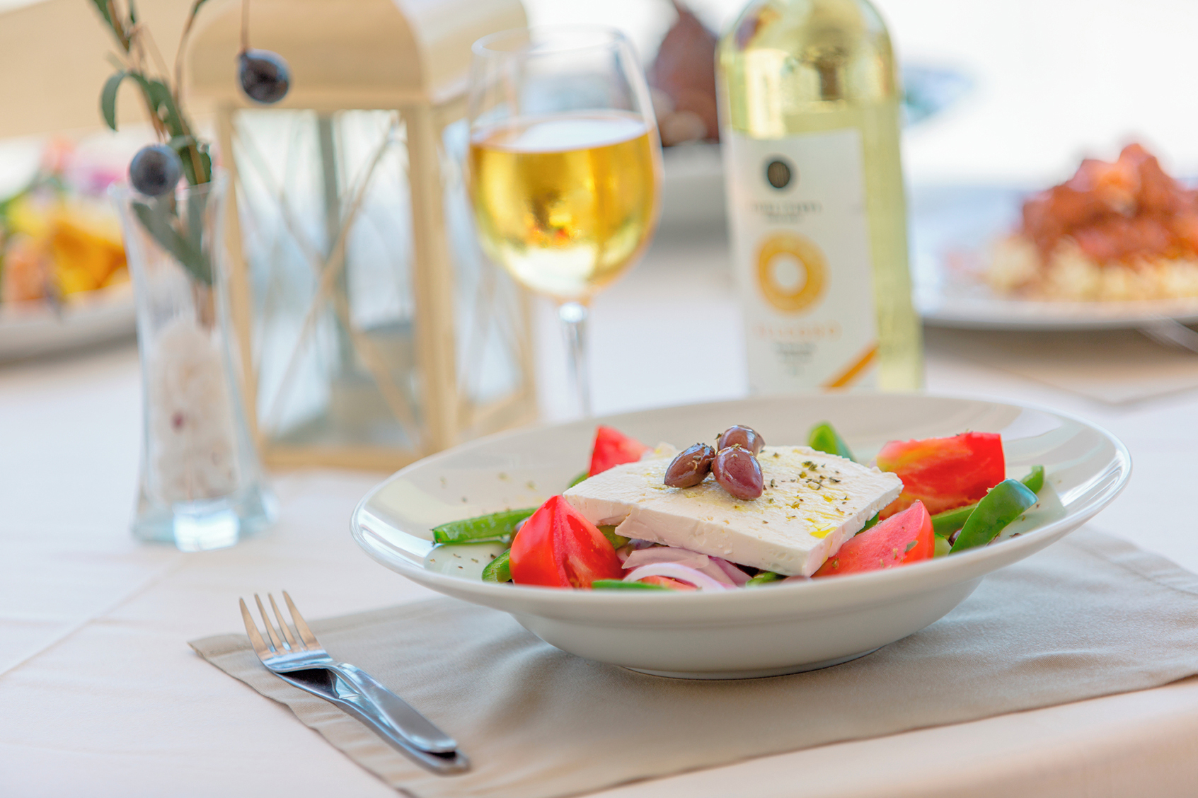 Enjoy Greek cuisine at a beachfront taverna