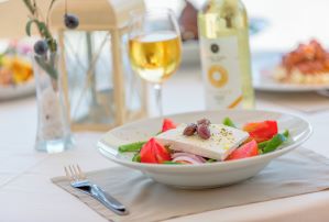 Enjoy Greek cuisine at a beachfront taverna