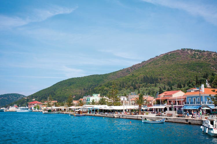 Panoramic view of Sami, with lush green hills in the background and colorful buildings in the foreground.
