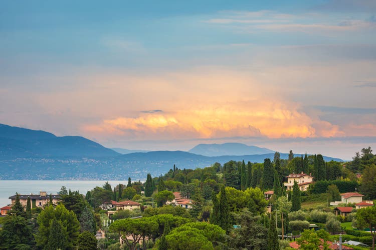 Portese, Italy, beautiful sunset above water at Lake Garda